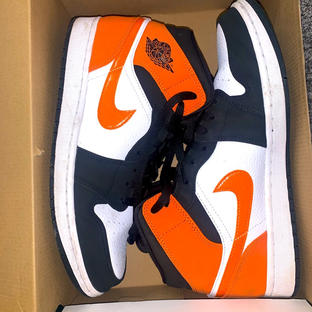 Jordan 1 Mids. Black and orange.